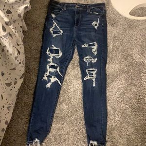 Ripped/patched American eagle blue jeans